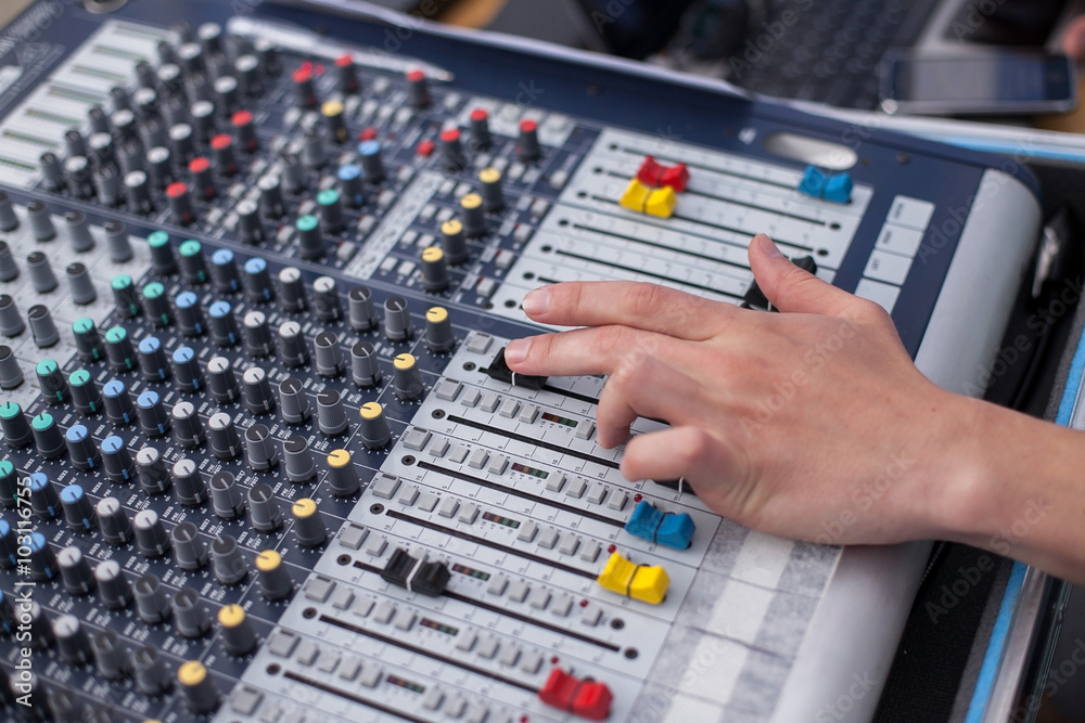 mixing panel. a hand of the person on the mixing panel mixing panel. a hand of the person on the mixing panel