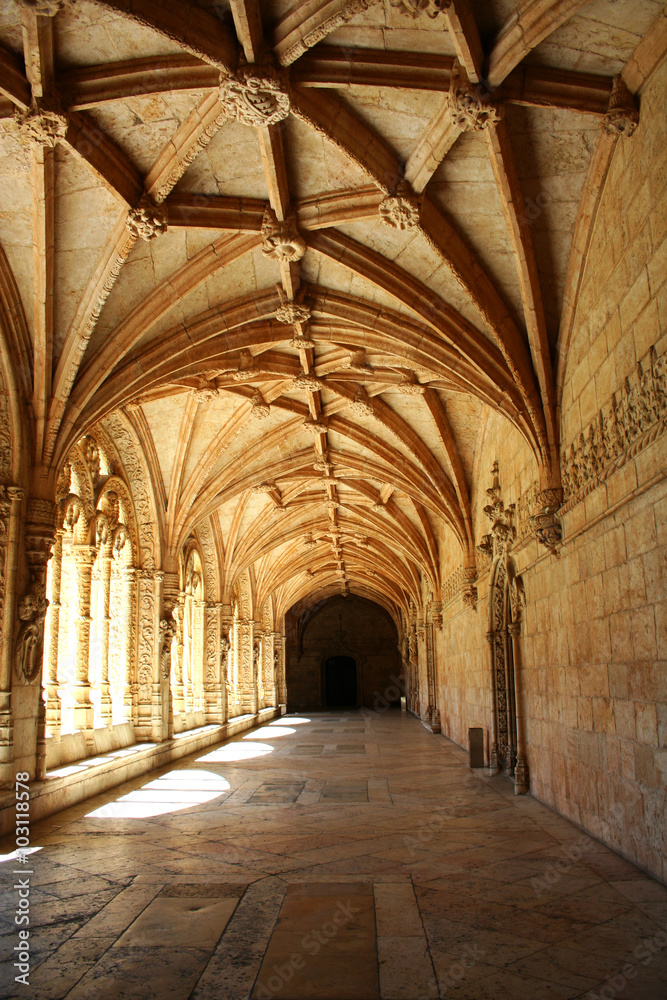 Carved arched corridor in monastery. The carved arched corridor in the monastery of Jeronimos in Lisbon, Portugal (Mosteiro dos Jeronimos)
