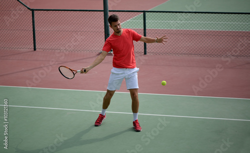 Male tennis player practice in tennis court © naufalmq