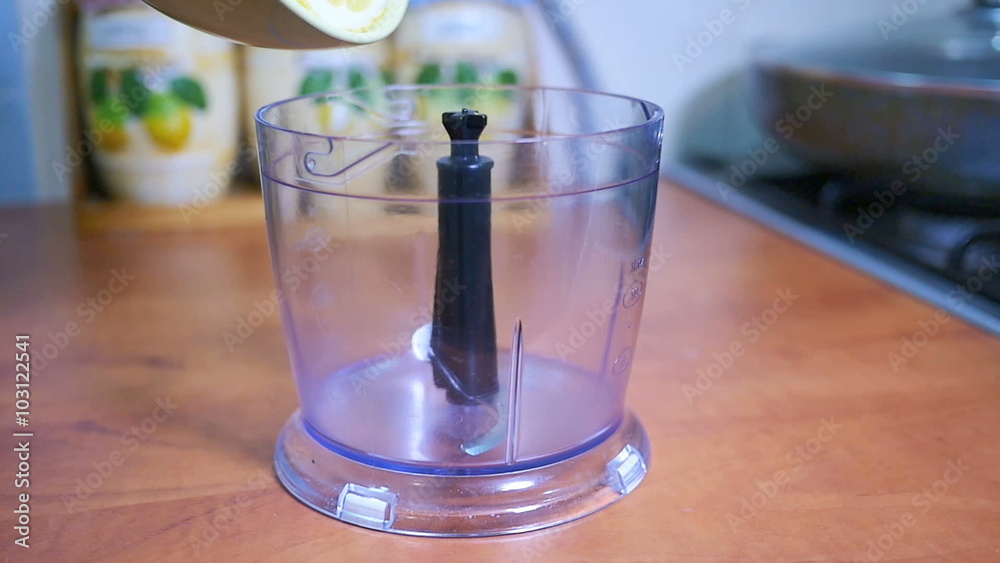 Sliced lemon poured into a blender, slow motion Sliced lemon poured into a blender, slow motion