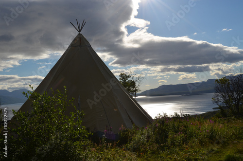 Wigwam in a meadow in subarctic valley, Bjorkliden, Swedish Lapland photo