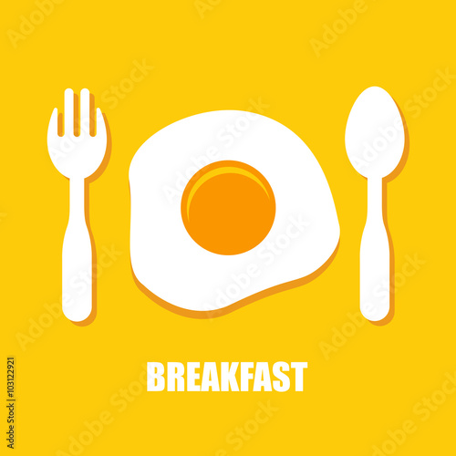 Fried eggs, spoon and fork - breakfast