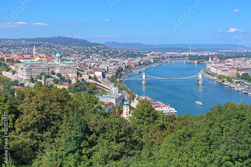 View of Budapest from Gellert Hill, Hungary. The image shows Buda Castle, Danube with Szechenyi Bridge and Margaret Bridge, Hungarian Parliament Building.