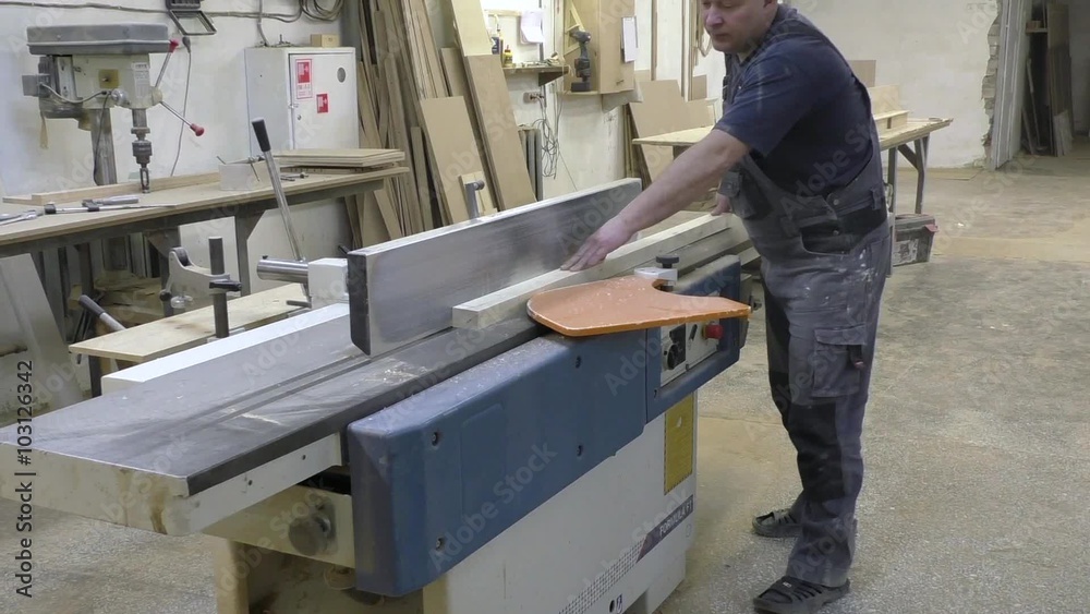 man working on planing machine man working on planing machine