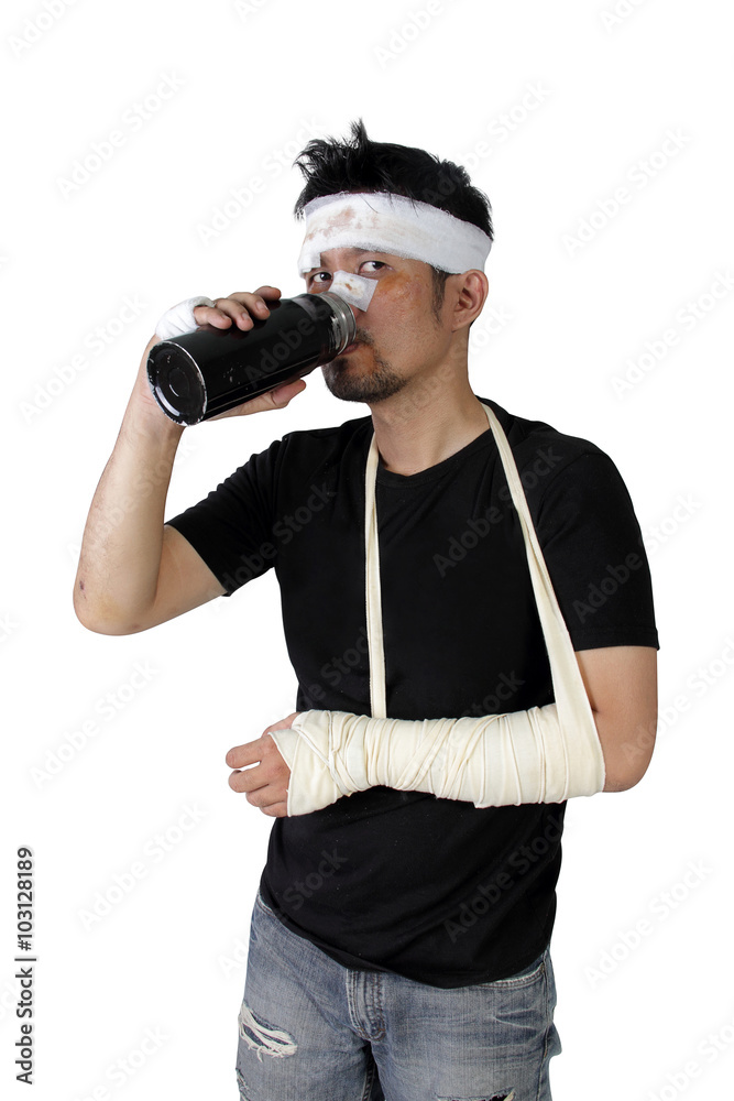Man in bandage drinks and looks at camera isolated Man in bandage drinks and looks at camera isolated