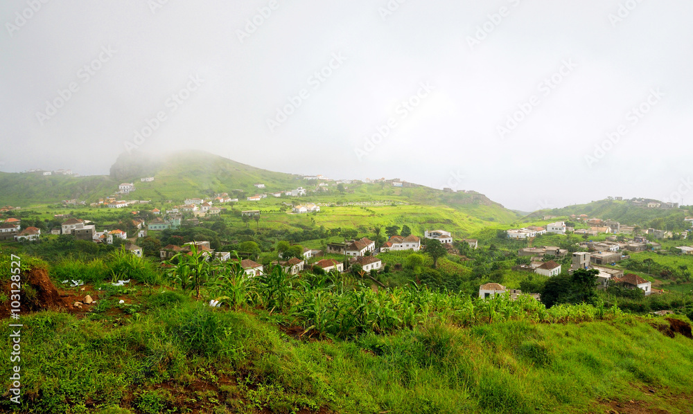 Fototapeta premium Fog engulfed city of Nova Sintra