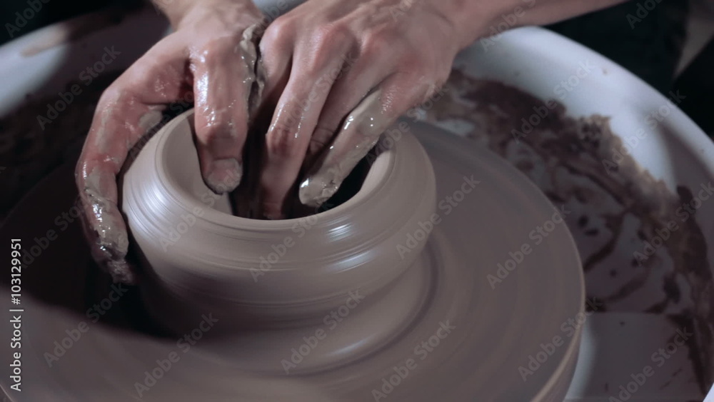 Pottery painting a traditional clay pot, close up Pottery painting a traditional clay pot, close up