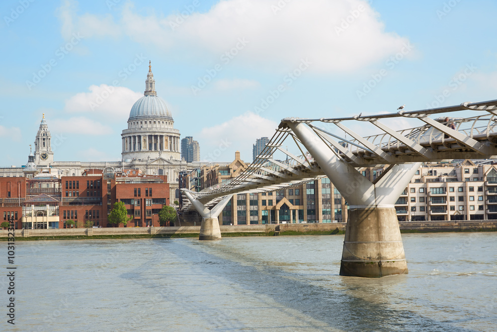 Millennium bridge and St Paul's cathedral in a sunny morning in London