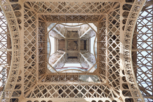 Eiffel tower structure under view in Paris, sunny day