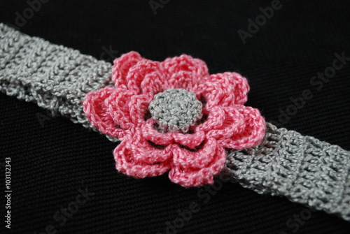 Headband grey with pink flower.