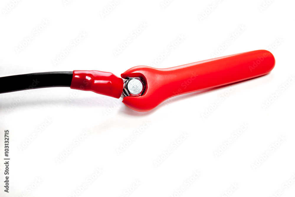 Red rubbered tools with wire on white background