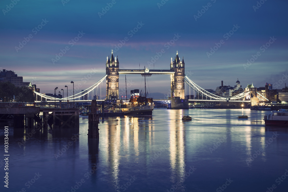 Famous Tower Bridge by night, London, England, United Kingdom, vintage filtered style
