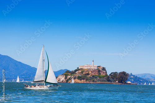 Yacht sail in front of Alcatraz prison island