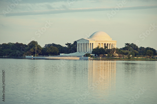 Jefferson Memorial and reflection on the Tidal Basin at sunset in Washington DC, United States of America, vintage filtered style 