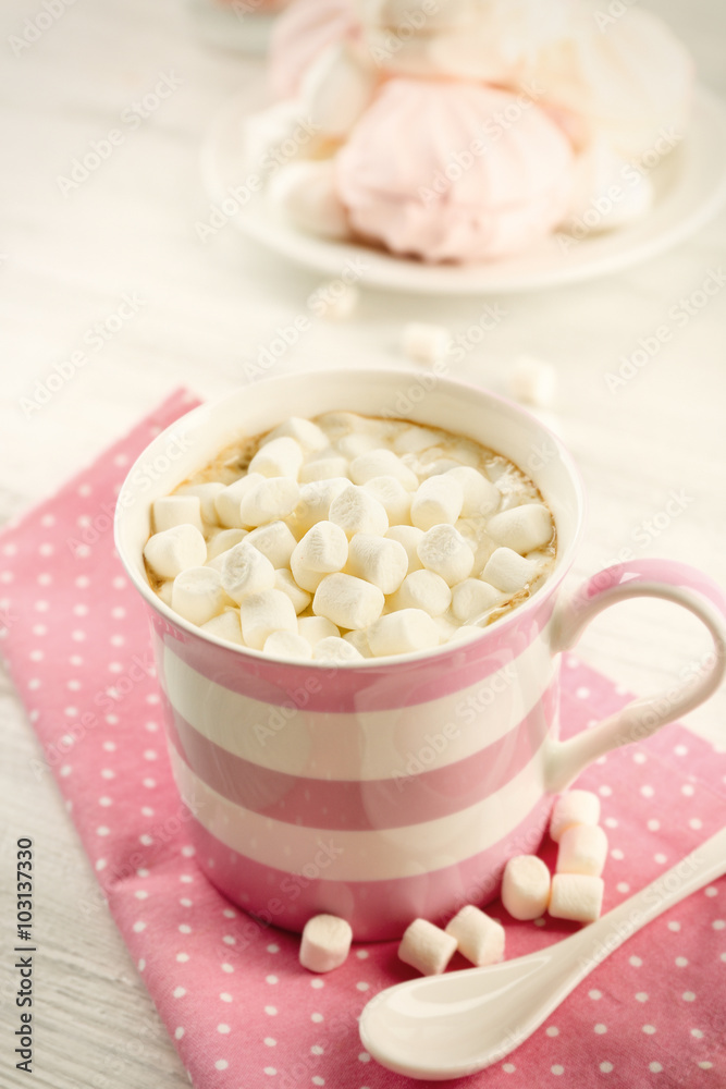 Mug of hot chocolate with marshmallows, on light wooden background Mug of hot chocolate with marshmallows, on light wooden background