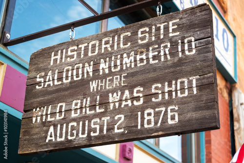 Sign marking the location where Wild Bill Hickok was shot in Deadwood, South Dakota photo