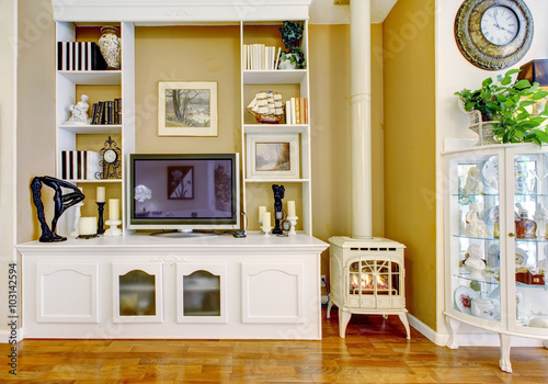 Amazing living room with white furniture and hard wood floor.