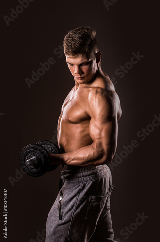 muscular bodybuilder man holding weights