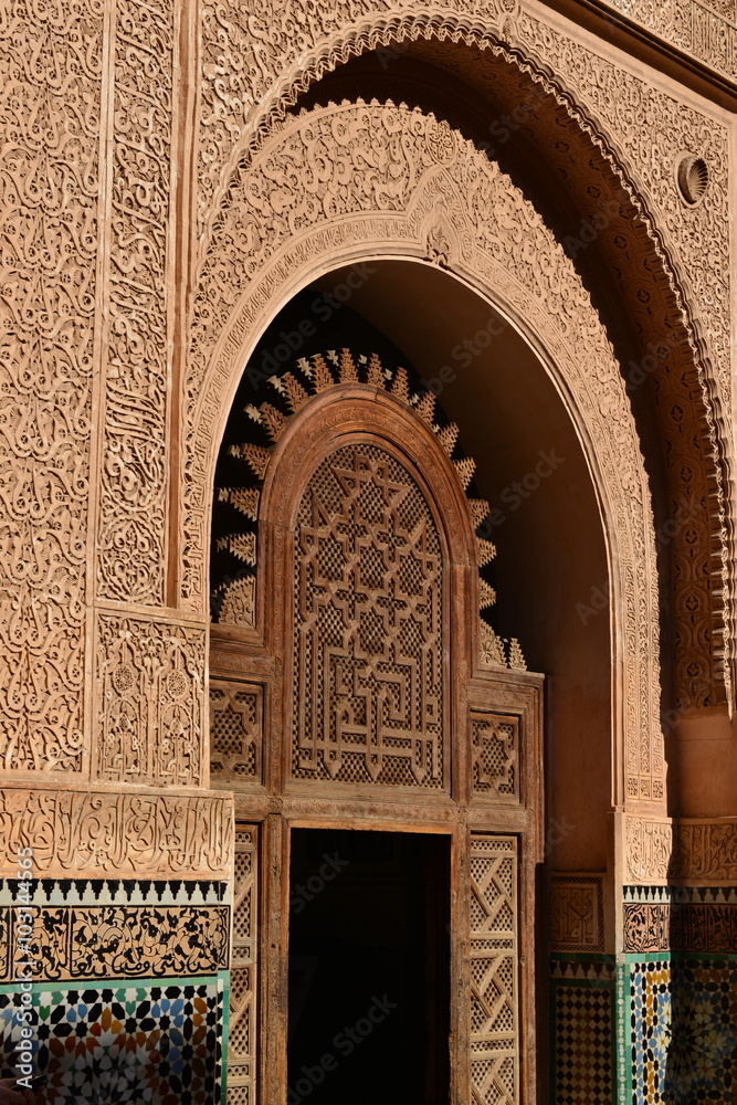 Medersa Ben Youssef, Marrakech, Morocco, Africa.  The Arabesque ornately decorated interior courtyard of an old school which taught the Koran.