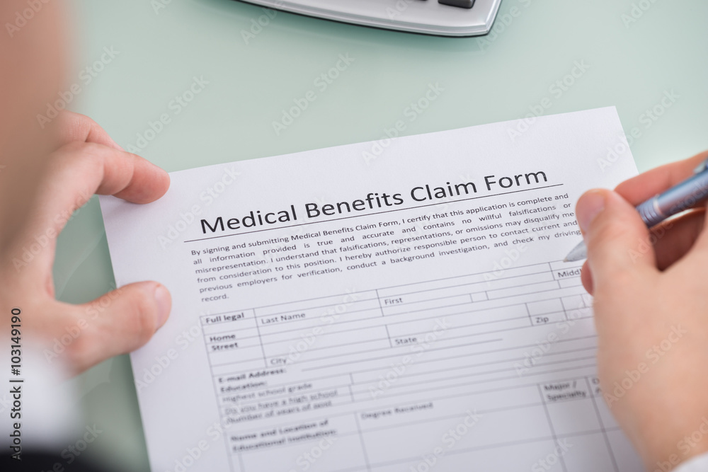 Person Hand Over Medical Benefits Claim Form Person Hand Over Medical Benefits Claim Form