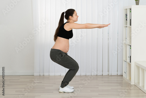 Young Pregnant Woman Doing Workout