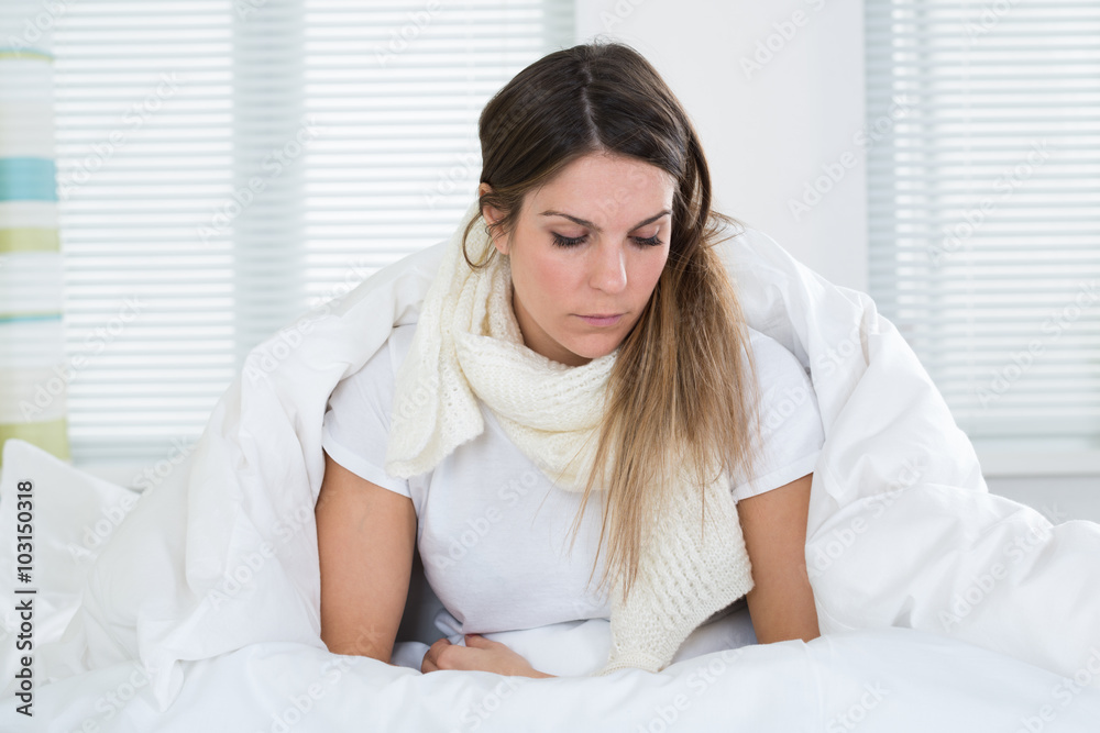 Fotografie Young Woman On Bed