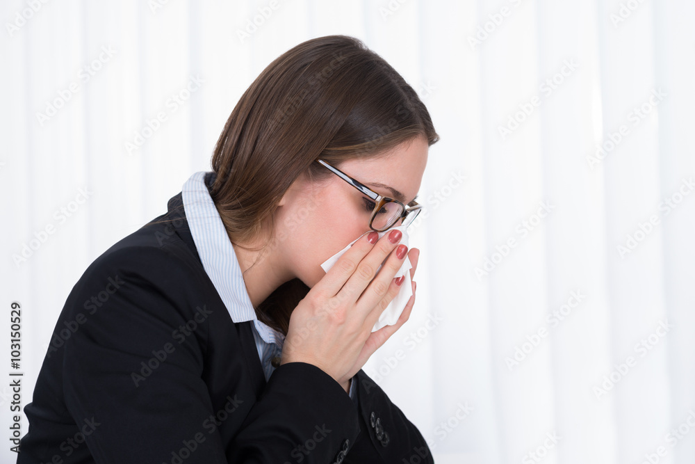 Businesswoman Blowing Her Nose In Handkerchief Businesswoman Blowing Her Nose In Handkerchief