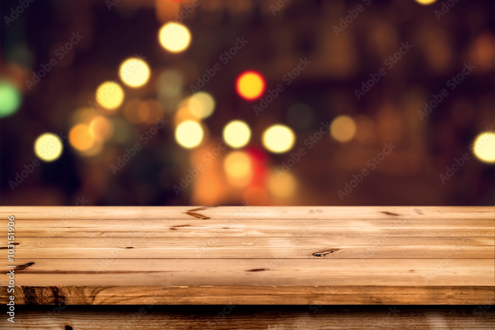Empty wooden table for product placement or montage with focus to the table top, blurred bokeh background . - obrazy, fototapety, plakaty 
