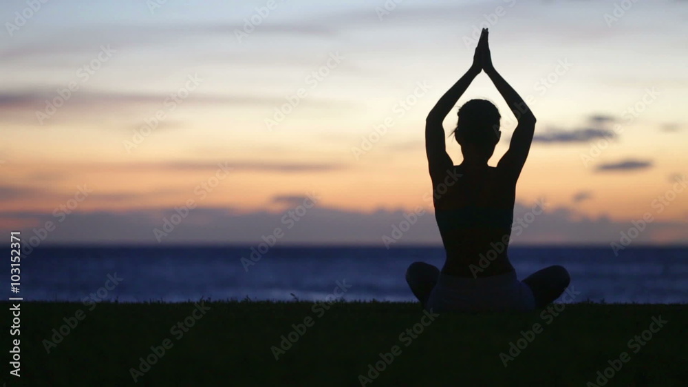 Meditation Yoga woman meditating at beach sunset or sunrise relaxing in yoga pose. Serene relaxed female yoga instructor in calm nature sea scene. Meditation Yoga woman meditating at beach sunset or sunrise relaxing in yoga pose. Serene relaxed female yoga instructor in calm nature sea scene.