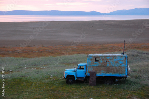 Old broken truck adapted as shed at tundra island