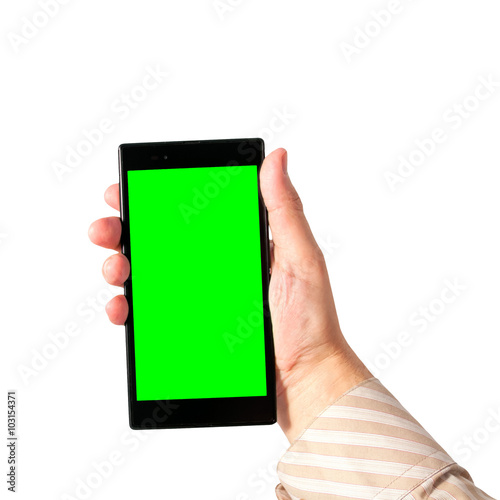 Man holds in hand smartphone in portrait mode with green screen isolated on white. Chroma key screen for placement of your own content.
 photo