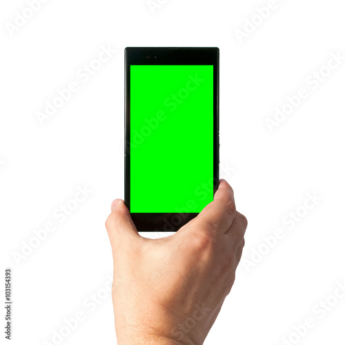 Man holds in hand smartphone in portrait mode with green screen isolated on white. Chroma key screen for placement of your own content.
 photo