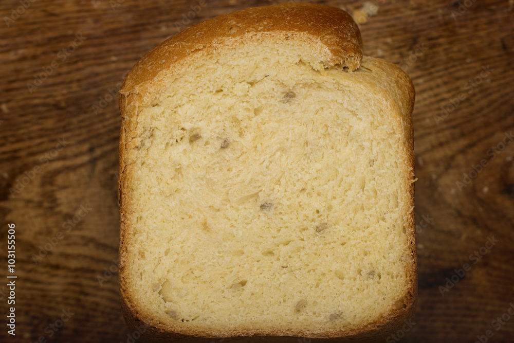 home-made bread with sunflower seeds from a bread machine on the kitchen board home-made bread with sunflower seeds from a bread machine on the kitchen board