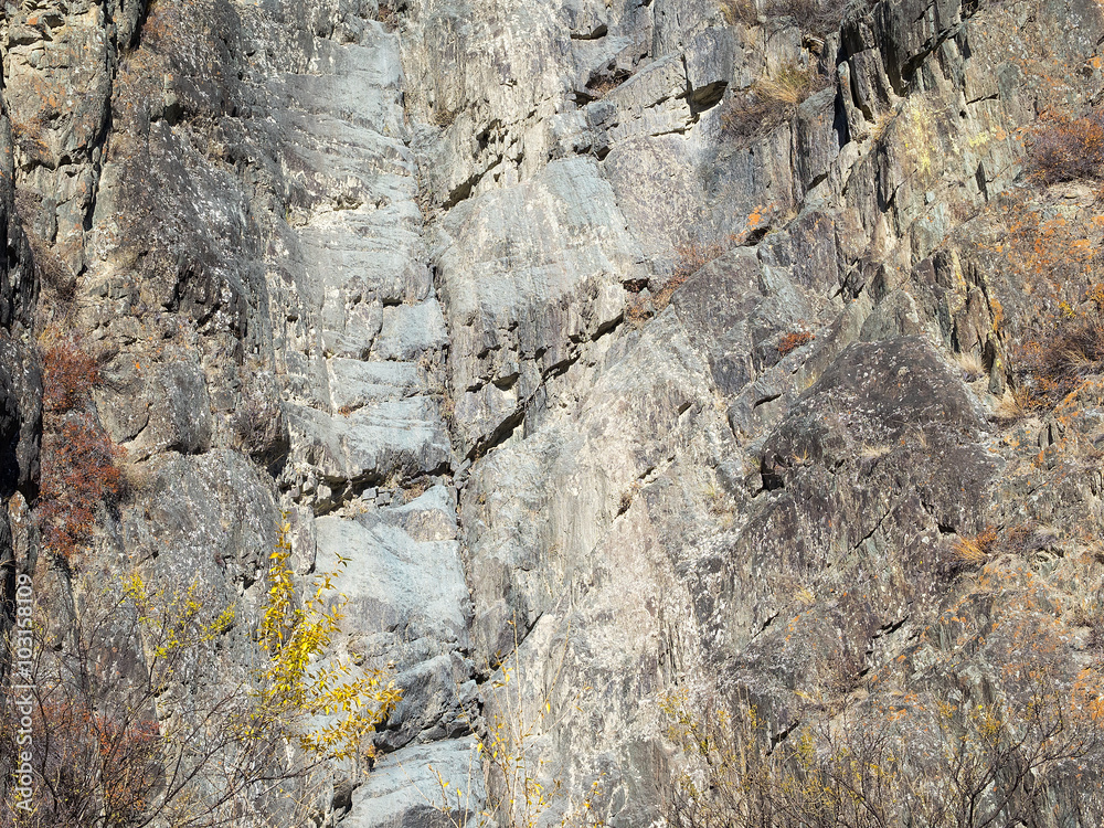 Wide gray stripe on the surface of the mountain. Wide gray stripe on the surface of the mountain.