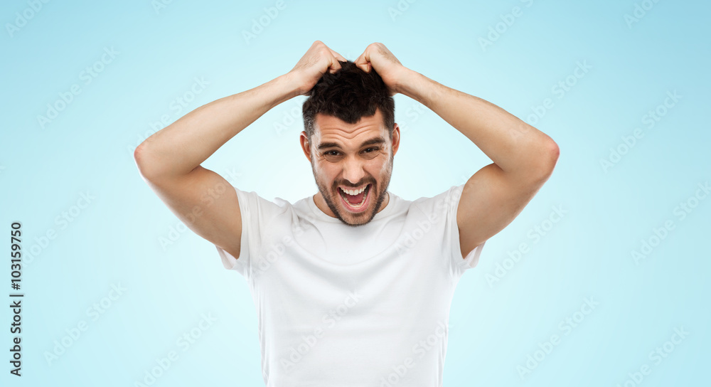 crazy shouting man in t-shirt over blue background crazy shouting man in t-shirt over blue background
