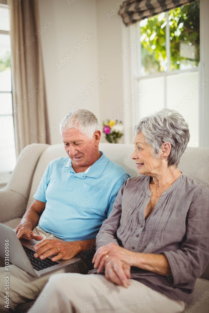 Senior couple looking at laptop Senior couple looking at laptop