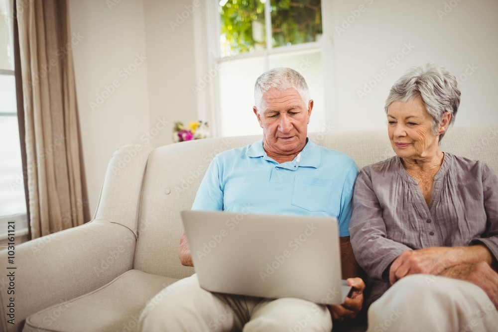 Senior couple looking at laptop Senior couple looking at laptop
