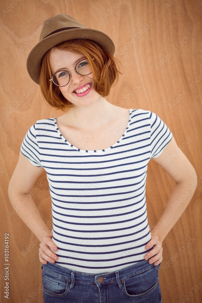 smiling hipster woman with her hands on her hips smiling hipster woman with her hands on her hips