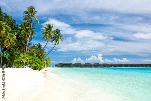 Beauteful white sand and blue water on Maldives islands