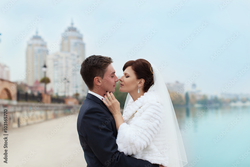 Gentle embrace bride and groom