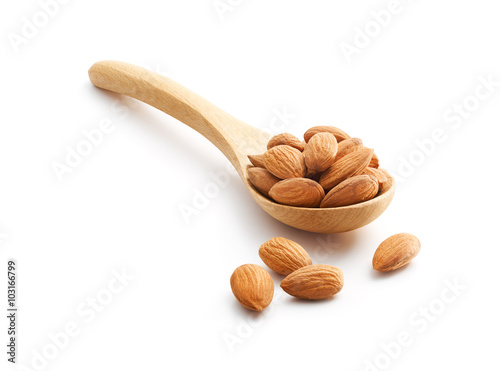 Almonds on wooden spoon photo