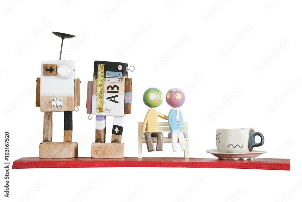 Fototapeta premium Colorful mini wooden robot models and coffee cup on red shelf is