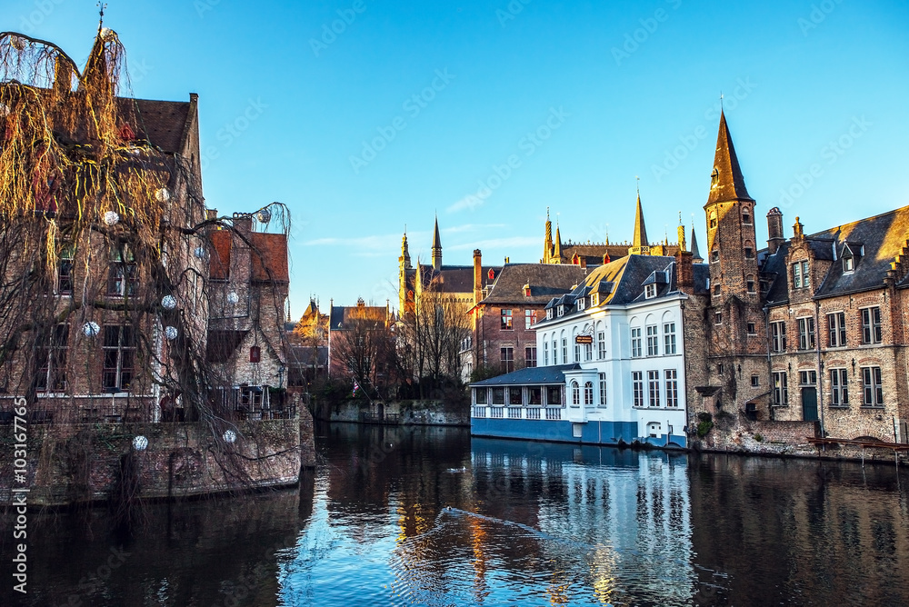 Bruges, Belgium. Image with Rozenhoedkaai in Brugge, Dijver river canal.