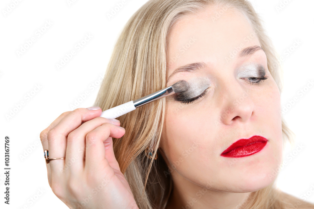 blond woman does make-up blond woman does make-up