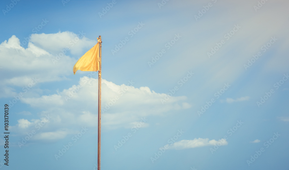 Fototapeta premium Yellow flag and blue sky