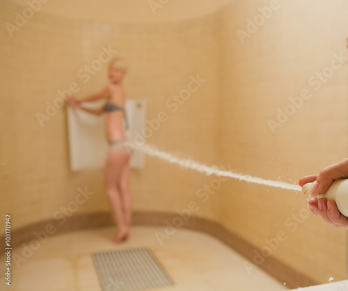 Woman having high pressure massage with Sharko shower photo