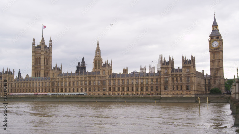 Slow motion shot of Big Ben and the Houses of Parliament seen across the River Thames, London. Slow motion shot of Big Ben and the Houses of Parliament seen across the River Thames, London.