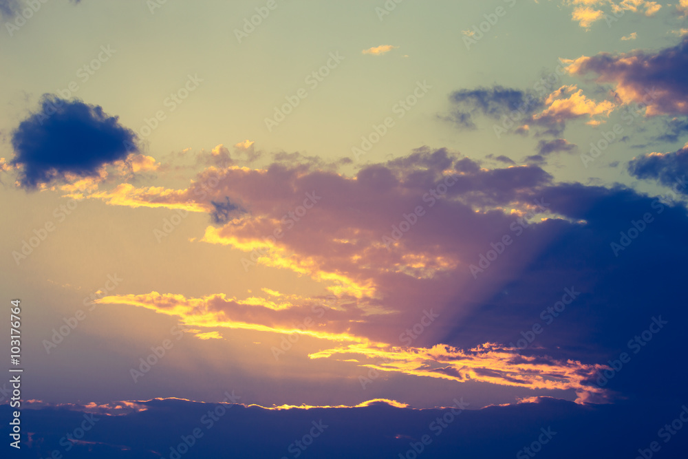 Fototapeta premium Clouds on the sky in sunset time. Toned