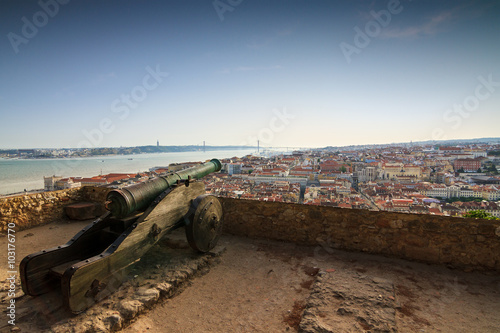 Big ancient cannon at castle Sao Jorge in Lisbon, Portugal, looking over the city