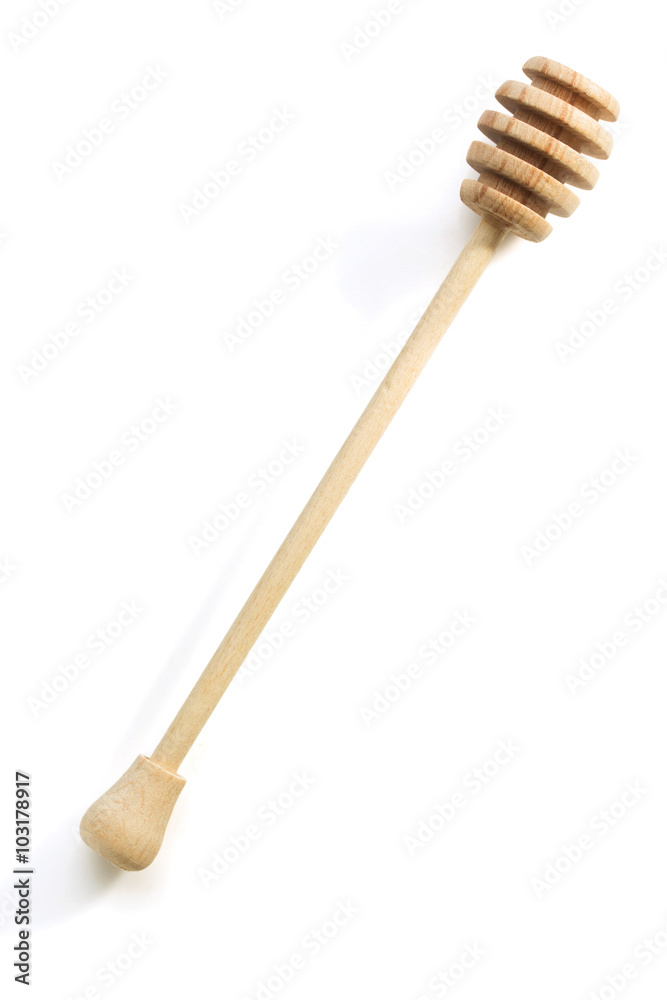 wooden honey stick on white wooden honey stick on white